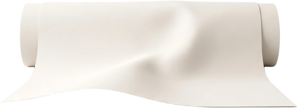 A roll of bone-white backdrop paper partly unrolled, its loose length sweeping forward into the classic studio curve